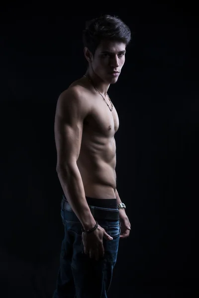 Handsome muscular shirtless young man standing confident — Stock Photo, Image