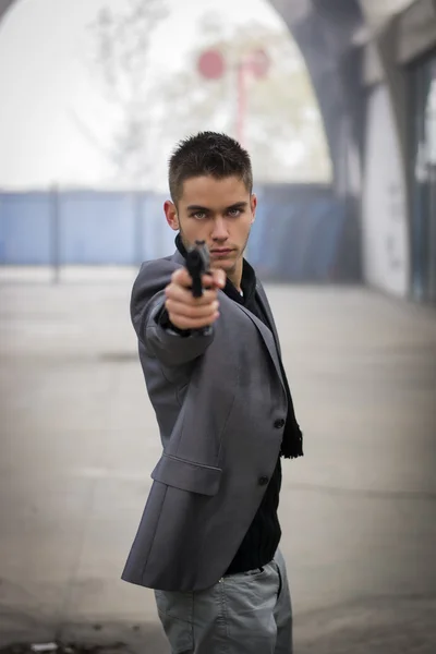 Detective or mobster or policeman aiming a firearm — Stock Photo, Image