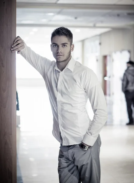 Handsome young businessman in office building — Stock Photo, Image