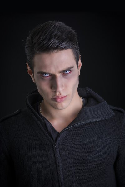 Portrait of a Young Vampire Man with Black Sweater