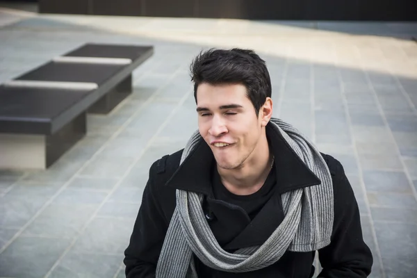 Handsome young man pulling a funny face — Stock Photo, Image