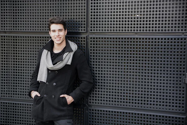 Trendy man in winter fashion against wall — Stock Photo, Image