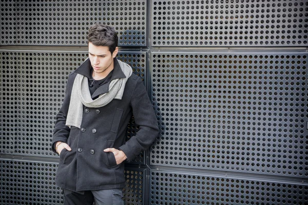 Trendy man in winter fashion against wall — Stock Photo, Image