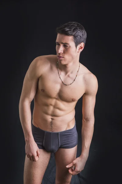 Fit shirtless young man wearing only underwear — Stock Photo, Image