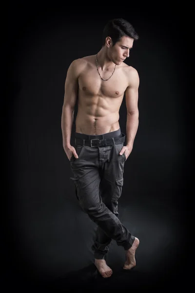 Full length shot of handsome, fit shirtless young man — Stock Photo, Image