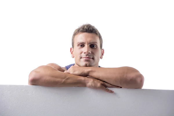 Man behind a blank horizontal white banner — Stock Photo, Image