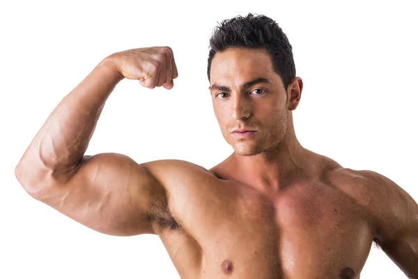 Bodybuilder che fa posa del bicipite — Foto Stock