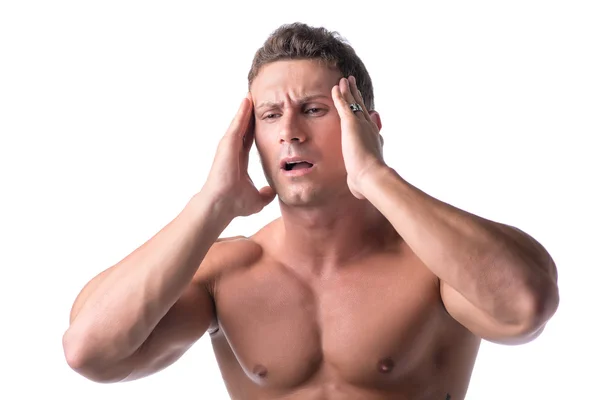 Muscular handsome man holding his head with for headache — Stock Photo, Image