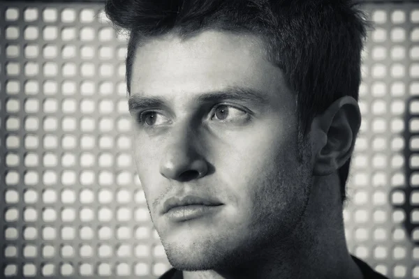 Headshot of attractive young man looking to a side — Stok Foto