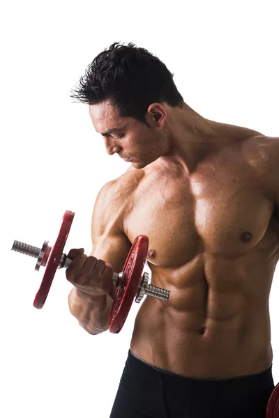 Muscular sexy shirtless young man exercising biceps — Stock Photo, Image