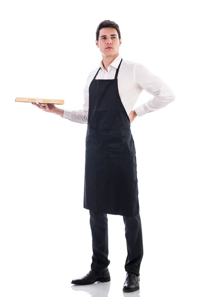 Attractive young chef or waiter holding pizza box — Stok Foto