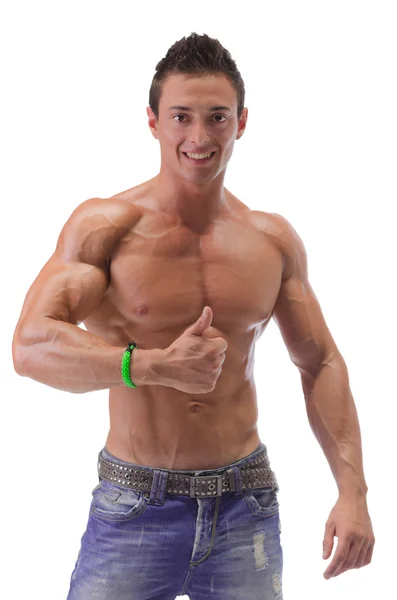 Homem muscular mostrando polegares para cima sinal — Fotografia de Stock