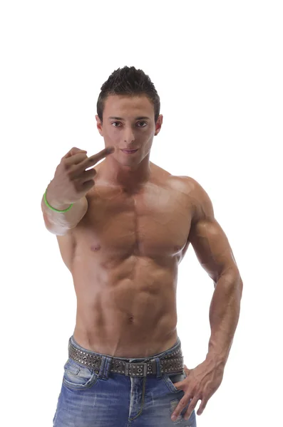 Shirtless muscular young man holding up middle finger — Stock Photo, Image