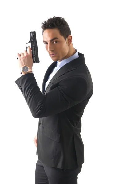 Uomo elegante con pistola, vestito da spia o agente segreto — Foto Stock