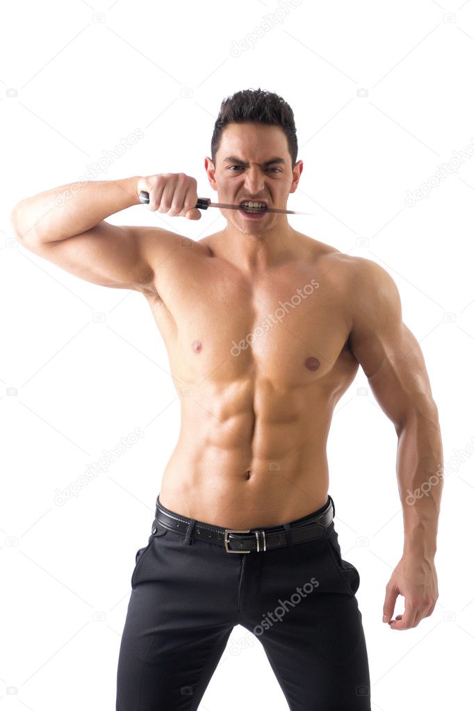 Muscular man holding big knife biting blade
