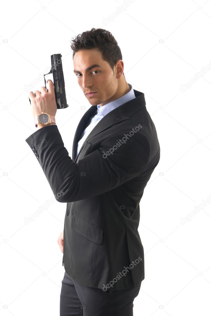 Elegant man with gun, dressed as a spy or secret agent