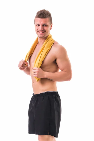 Handsome power athletic young man holding towel — Stock Photo, Image