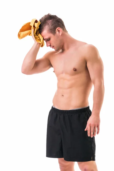 Handsome power athletic young man holding towel — Stock Photo, Image