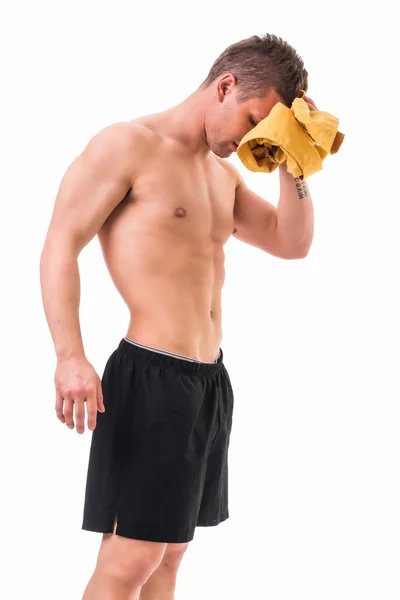 Handsome power athletic young man holding towel — Stock Photo, Image