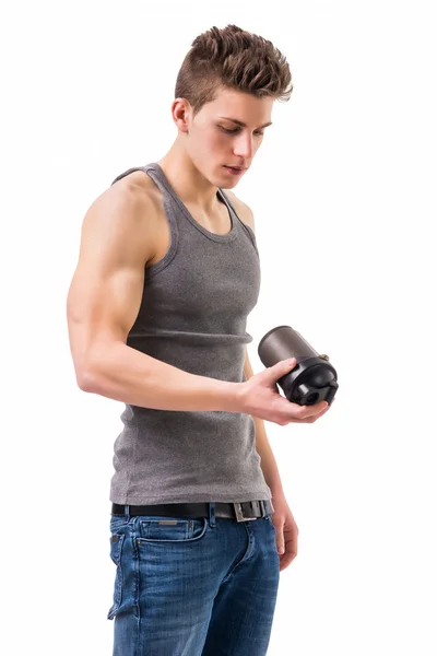 Attractive young man holding protein shake bottle — Stock Photo, Image