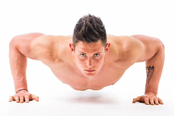 Shirtless bodybuilder doing push-ups — Stock Photo, Image