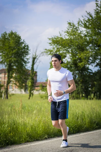 Young man running and jogging — Stock Photo, Image