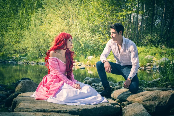 Fairy Tale Couple Sitting on Large River Rocks — Stock Photo, Image