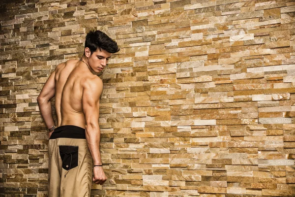 Attractive and muscular shirtless young man — Stock Photo, Image