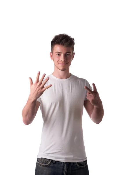 Handsome young man counting to seven 7 with fingers and hands — Stock Photo, Image