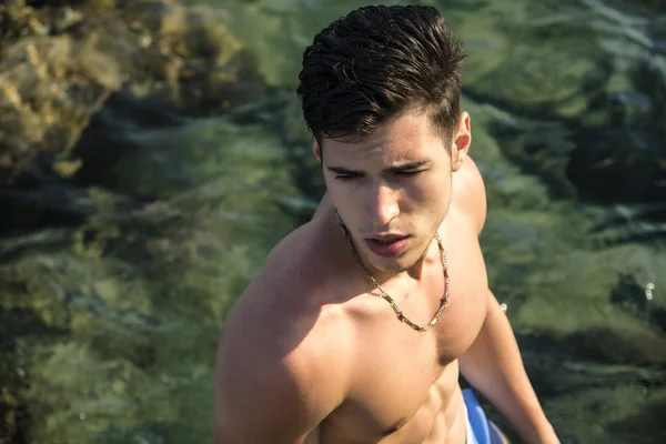 Young man at sea seen from above perspective — Stock Photo, Image