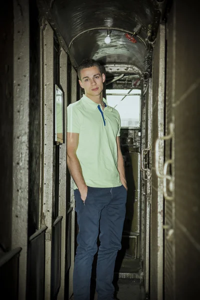 Young Man Standing with Hands in Pockets on Train — Fotografie, imagine de stoc