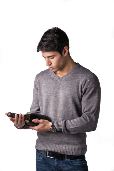 Young man holding bottle of champagne or white wine — Stock Photo, Image