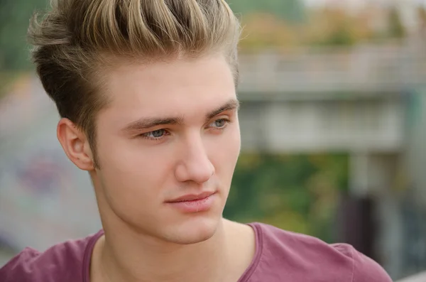 Handsome blond young man head-shot outside — Stockfoto