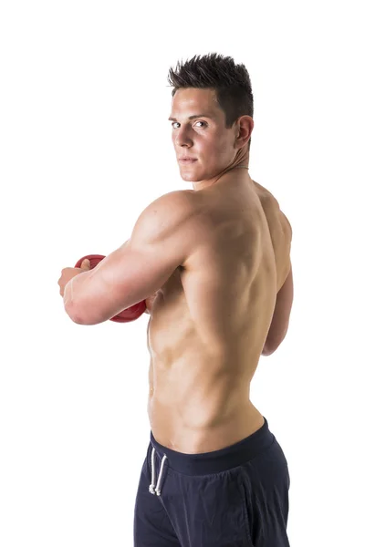 Handsome young man holding weight disc — Stock Photo, Image