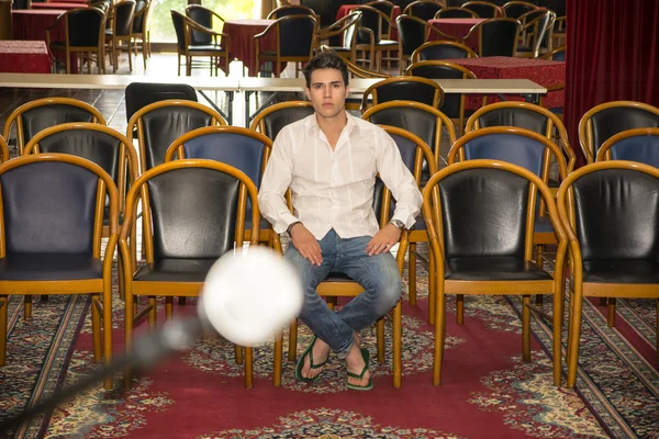 Handsome Man Sitting at the Audience Chair Alone — Fotografia de Stock