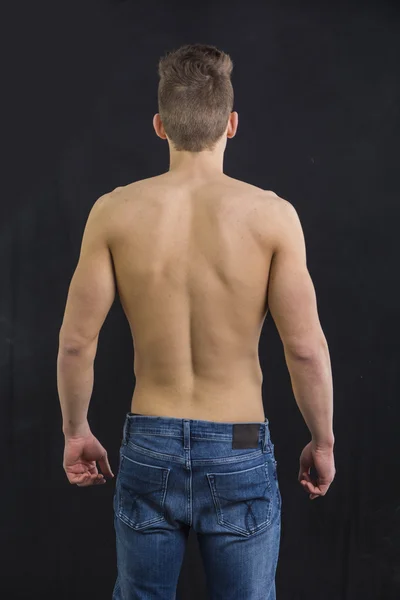 Muscular back of young man relaxed — Stock Photo, Image