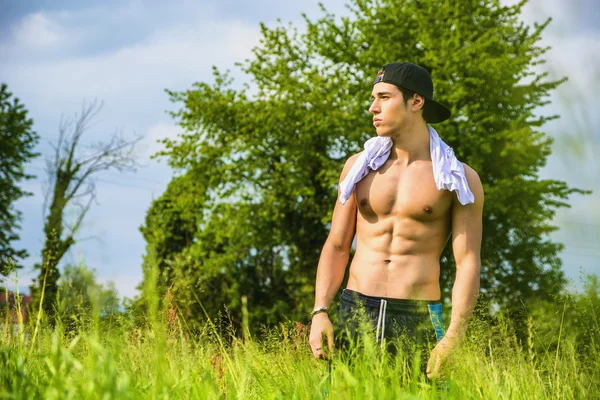 Handsome shirtless fit young man at countryside, — Stock Photo, Image