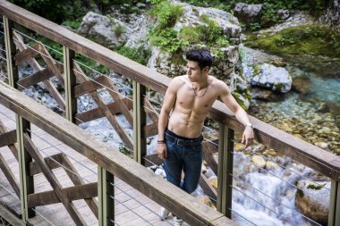 Athletic Man Leaning Against Pathway Rail