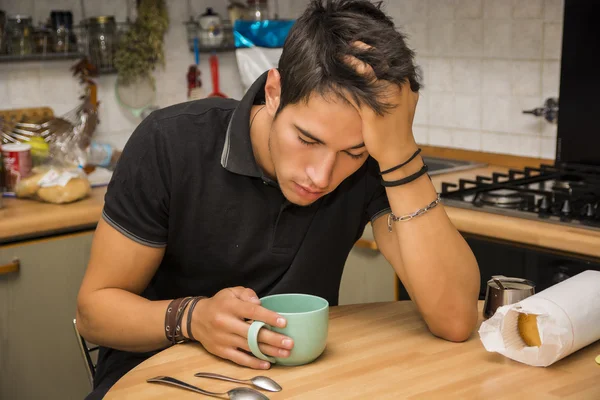 Tired Man with Coffee Sitting at Kitchen Table — Stock Photo, Image