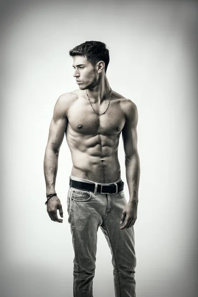 Handsome shirtless athletic young man on white — Stock Photo, Image