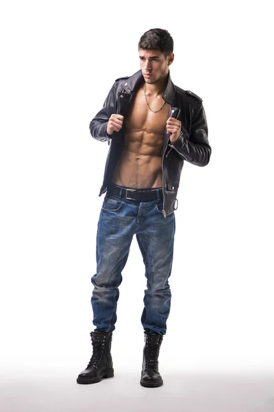 Handsome young man wearing leather jacket on naked torso, isolated over white — Stok Foto