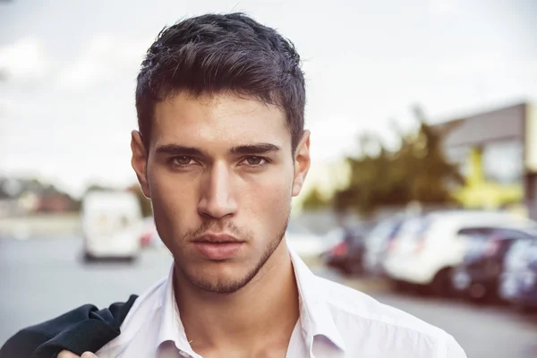 Attractive young mans headshot in urban environment — Stock Photo, Image