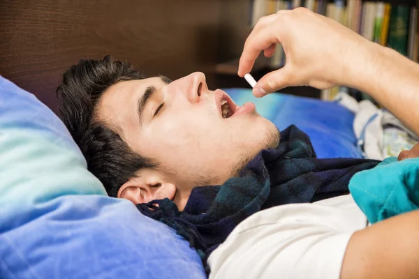 Young man one taking medicine pill — Stock Photo, Image