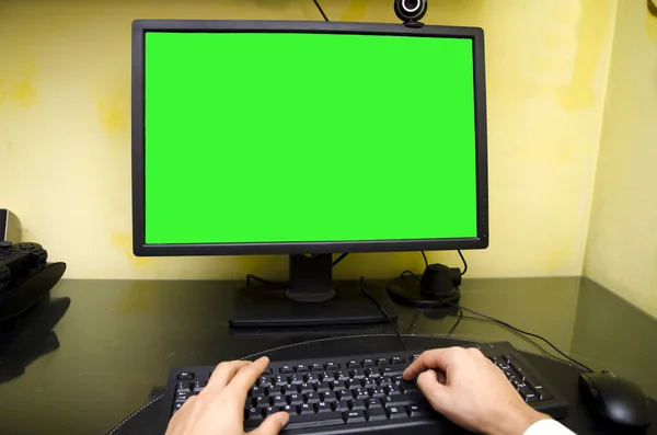 POV of worker sitting at his desk working at computer — Fotografia de Stock