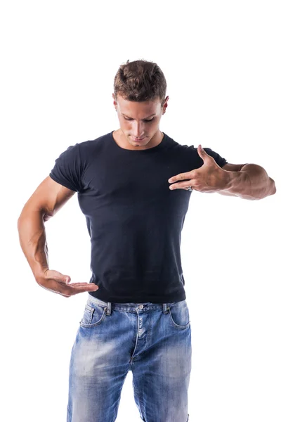 Muscular Man Showing Copyspace on Blank T-Shirt with Hands — ストック写真