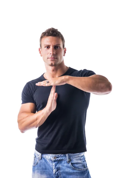 Young man gesturing time out sign with his hands — 图库照片