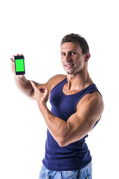 Attractive young man showing his cell phones blank green screen — Foto Stock