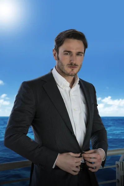 Young man against handrail on cruise ship — Stock Photo, Image