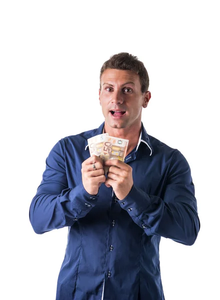 Young man holding two bank notes — Stock Photo, Image