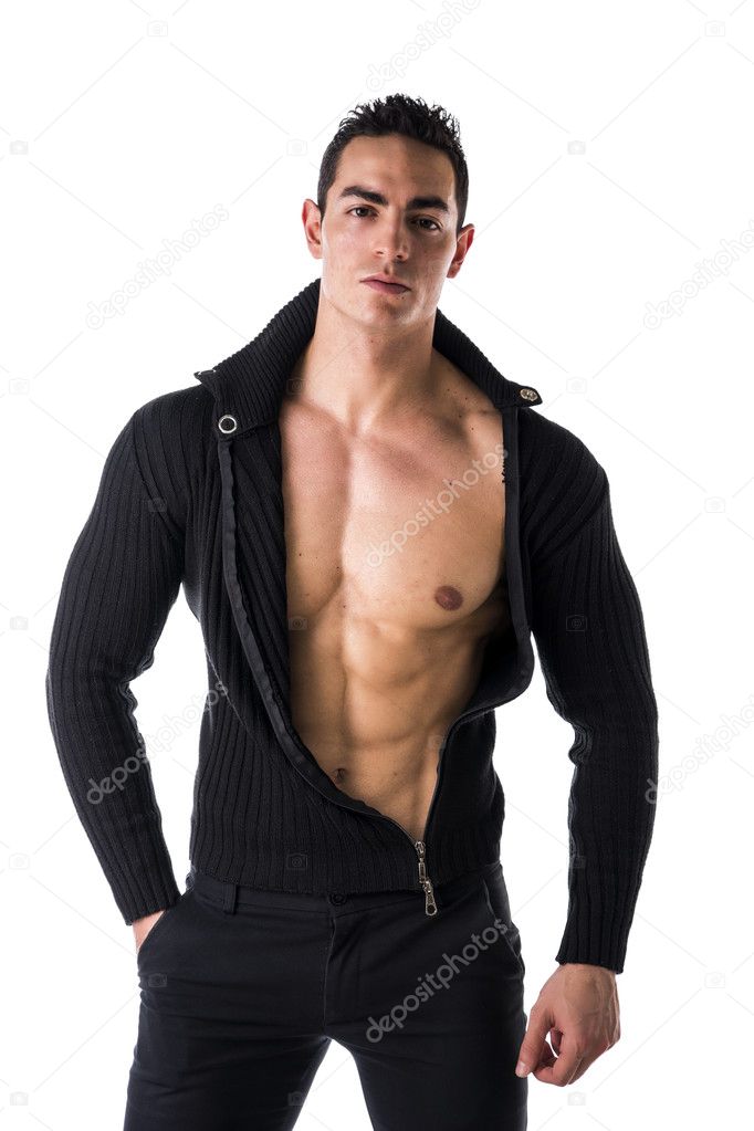 Handsome muscular young man taking off shirt